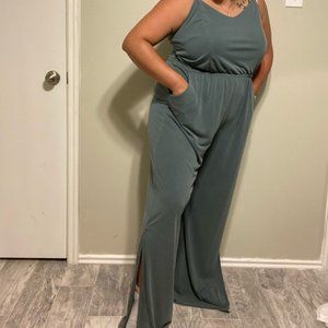 Charming Charlie Pocket jumpsuit with leg slits!